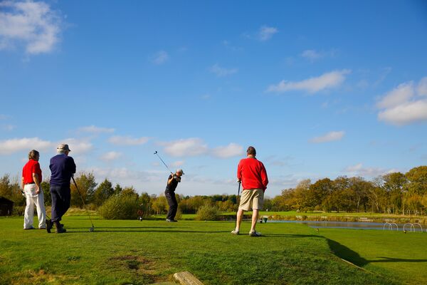 #caption-138 Teeing off across the lake